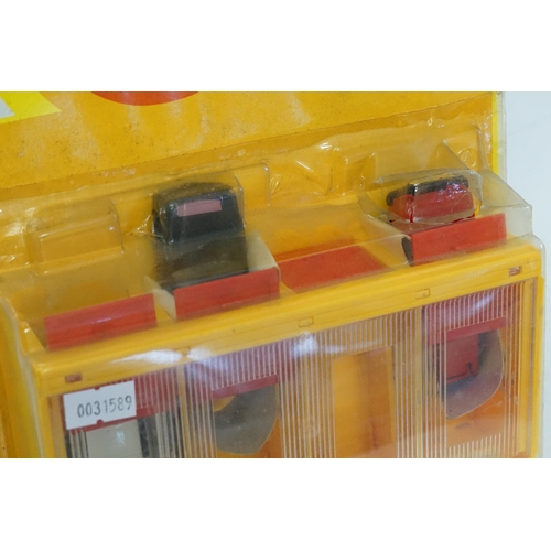 120 - A Scarce Corgi Junior Car Garage with Three Cars to include a 