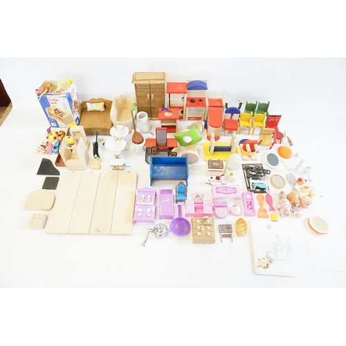 511 - A large Collection of Dolls Furniture in Wood & Plastic consisting of a Cooker, Toilet, Wardrobe, Ch... 