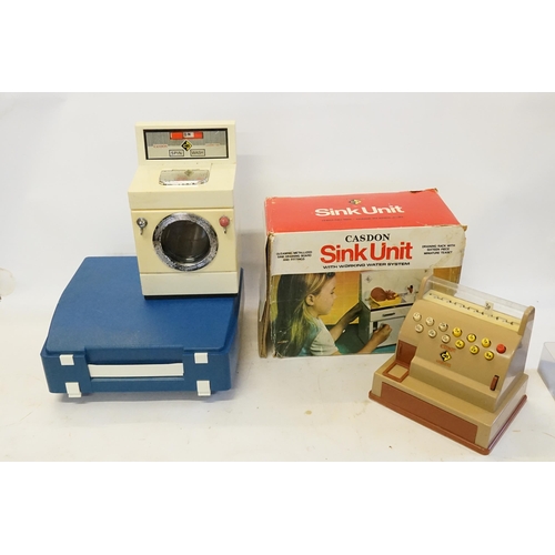 583 - Four 1970s Children's Toys to include a Boxed Casdon Sink Unit, a Casdon Washer/Dryer, a Casdon Till... 