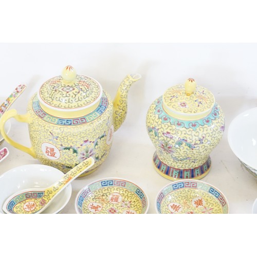 647 - A Chinese Cantonese enamelled Yellow Ground Tea Pot with Chinese Characters, Rice Bowls, Spoons, Gin... 