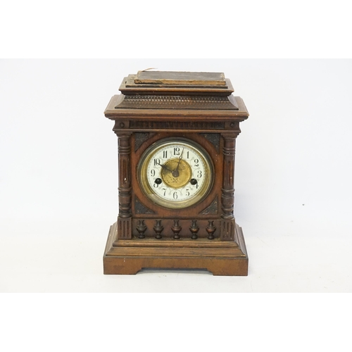 178 - A Victorian stained mahogany bracket clock, with white face.