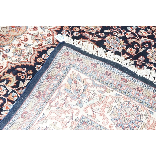 503 - A Dark Blue Ground Central Floral Medallion & Single Cream Bordered Carpet Rug with Fringe. Measurin... 