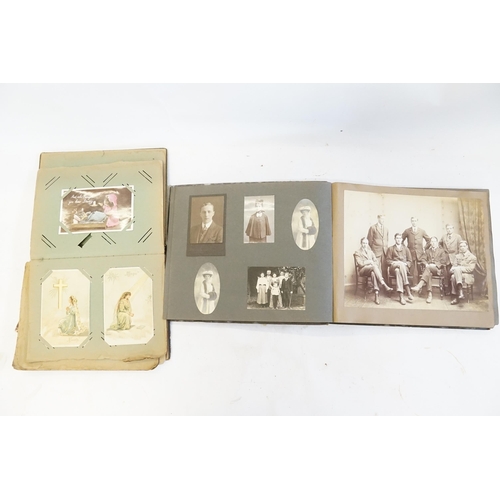 233 - A Family Postcard Album containing a Collection of WWI & Regional Cards along with a Family Photogra... 