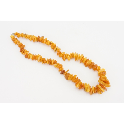 85 - A Naturalistic Formed Amber & Coloured Bead Necklace.