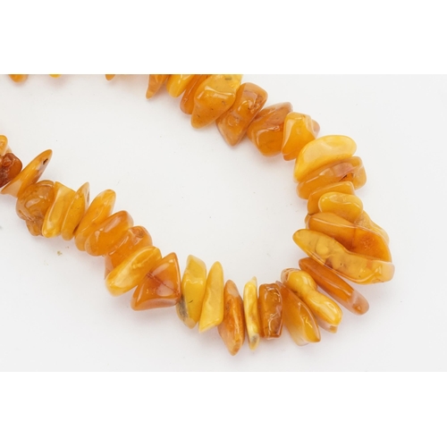 85 - A Naturalistic Formed Amber & Coloured Bead Necklace.