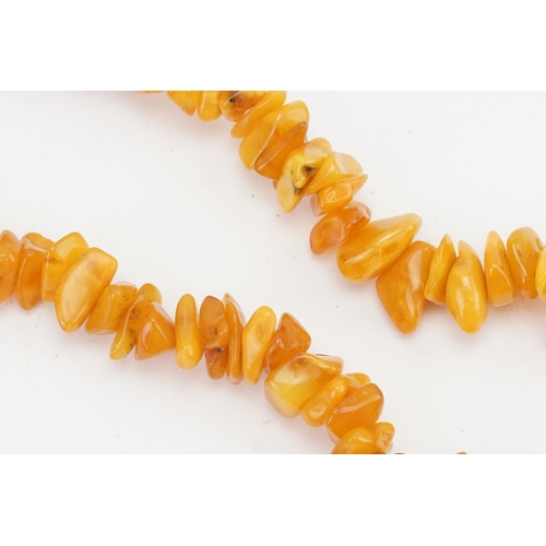 85 - A Naturalistic Formed Amber & Coloured Bead Necklace.