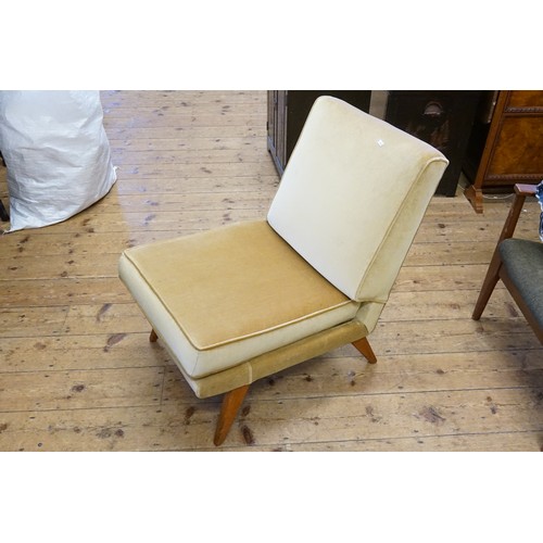 449 - A 1950s design Low Down Chair upholstered in cream velour resting on swept out legs.