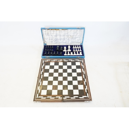 705 - A Bone Cased Chess Set with a Collapsible Chess Board.