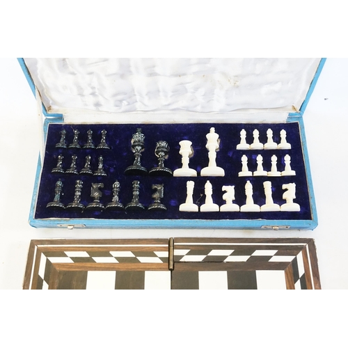 705 - A Bone Cased Chess Set with a Collapsible Chess Board.