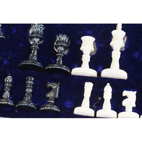 705 - A Bone Cased Chess Set with a Collapsible Chess Board.