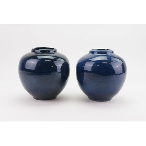 594 - A Pair of Powder Blue Glazed Bulbous Vases. Measuring: 16cms High.