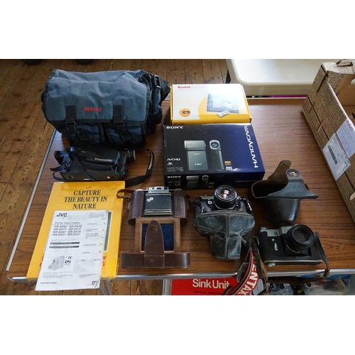 329 - A Zenit B Leather Cased Camera, an Agifold Camera with Flash attachment, a Pentax MX Camera in Case,... 