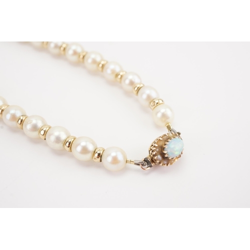 82 - A 9ct gold opal set clasp, hung with a strand of pearls. 5.5 x 4.1. Weight 26g.