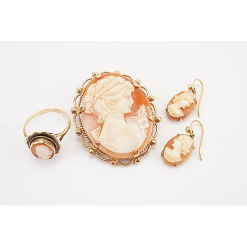 131 - A pair of gold coloured cameo earrings, along with a cameo ring and a 9ct gold cameo brooch. Total w... 