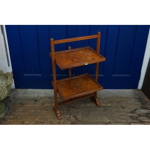 439 - A 1920s Two Tier Tea Stand in Walnut. Measuring: 46cms across x 83cms high.