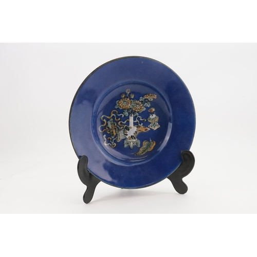 565 - Ex Collection of Rev. John Gage Waller. A Powder Blue Chinese Saucer Dish decorated with a Four Char... 