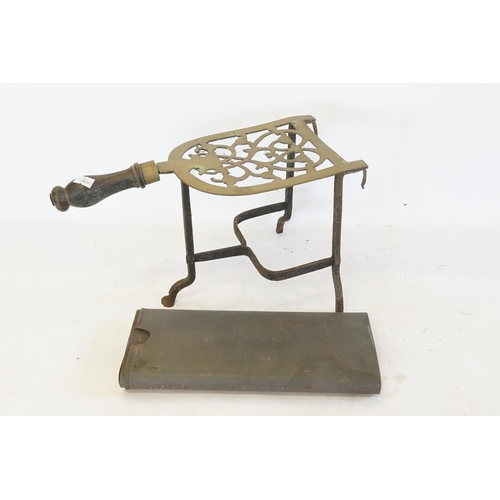 357 - An Antique Brass Trivet with Wooden Handle & a Sectional Picture Bomb Case.