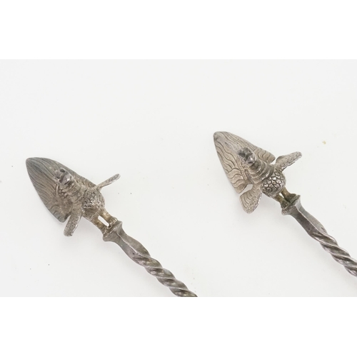 24 - A Pair of Indian Silver Serving Spoons decorated with Deities.