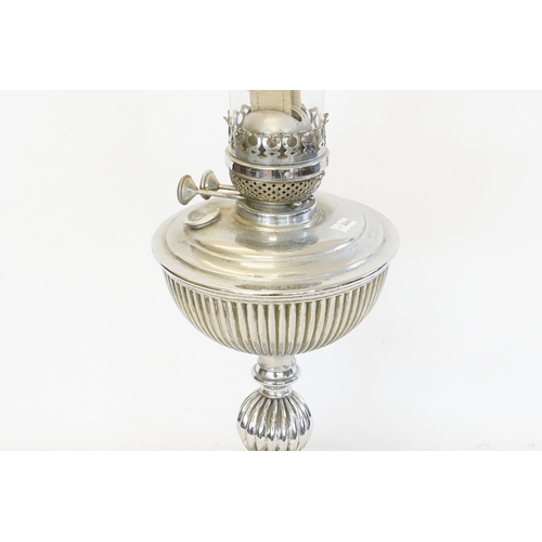 492 - An Oil Lamp in Chrome resting on a Square Base with Fluted Decoration.