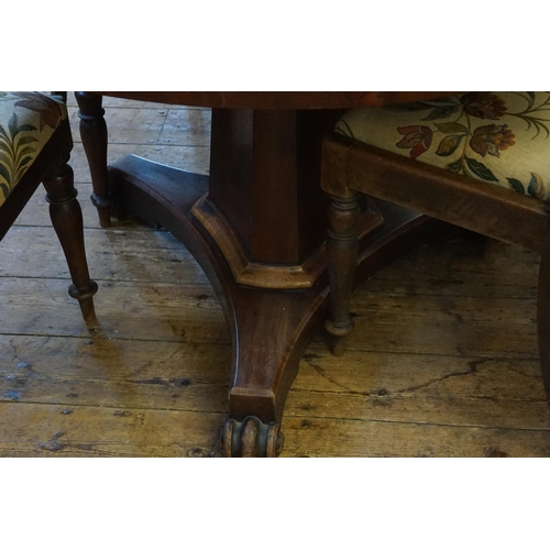 431 - A Victorian Circular Mahogany Tilt-Top Breakfast Table with a Triangular Plinth & Paw Feet along wit... 