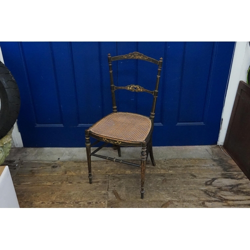 433 - A Regency design Black Lacquered & Painted Bedroom Chair with a Cane Seat.