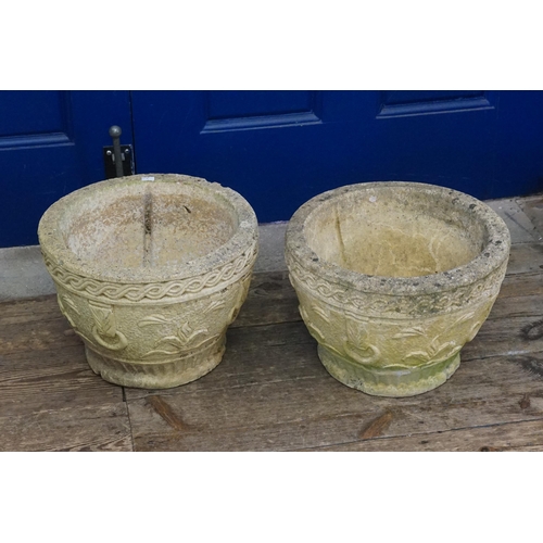 499 - A Pair of Concrete Garden Urns with Decoration. Measuring: 24cms High.