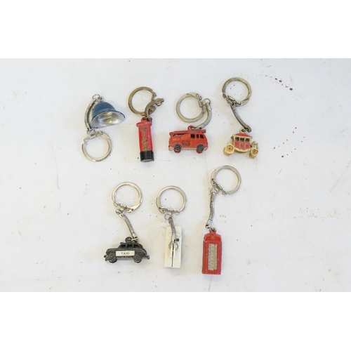 401 - A collection of car key chains, to include taxi, ambulance and fire engine.