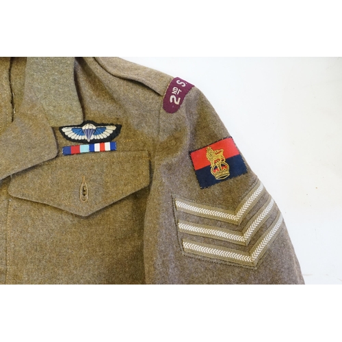 245 - A British WWII 2nd SAS Parachute Reg officers jacket and badges. Kings Crown War officer unit insign... 