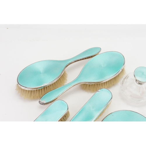 40 - A 1932 Horton & Allday 7 piece silver and turquoise enamelled dressing table set. One pot lid not ma... 