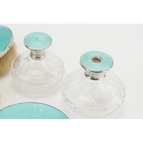 40 - A 1932 Horton & Allday 7 piece silver and turquoise enamelled dressing table set. One pot lid not ma... 