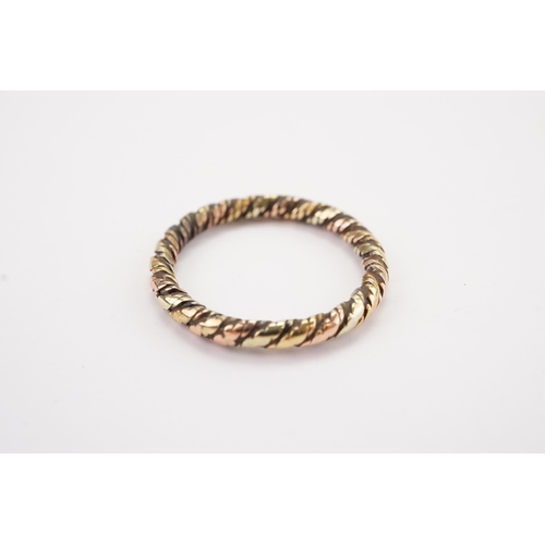 94 - A unmarked gold rope design tri colour ring. Weight 3g. Size O.