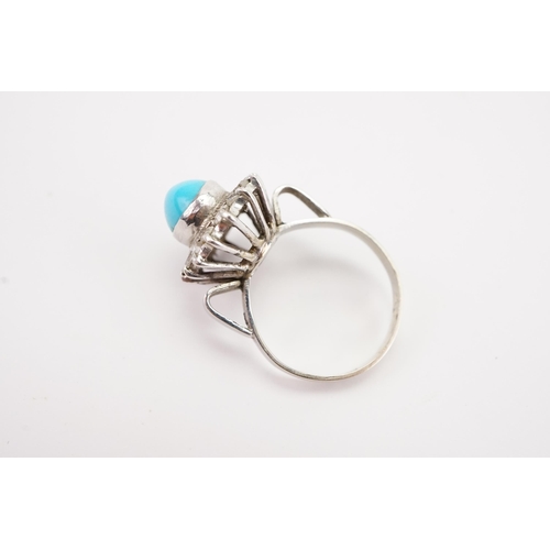 120 - Ex Collection of Mariam Jans Daughter. A antique high carat white gold turquoise set ring, surrounde... 