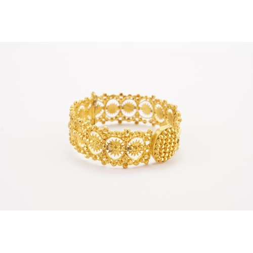 104 - Ex Collection of Mariam Jan (Merjan). A high carat gold Iranian arm band, pinch clasp and single hin... 