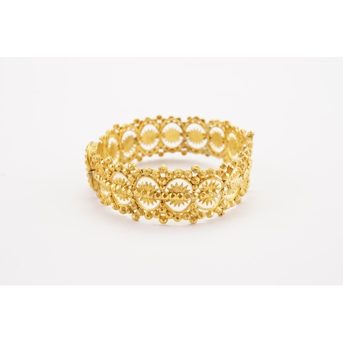 104 - Ex Collection of Mariam Jan (Merjan). A high carat gold Iranian arm band, pinch clasp and single hin... 