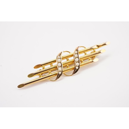 115 - Ex Collection of Mariam Jans Daughter. A 9 carat gold seed pearl set musical note brooch. Weight 2.1... 