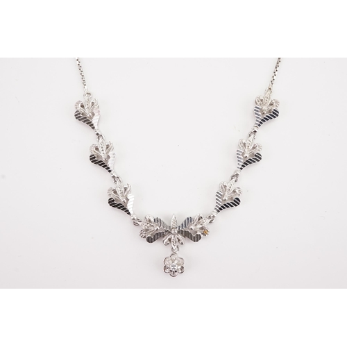 118 - Ex Collection of Mariam Jans Daughter. A high carat white gold necklace in a floral design. Weight 1... 