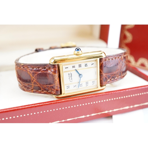 138 - A 1990's Cartier tank vermeil watch, marked 925, 20.5mm case size with Roman numerals. Quartz moveme... 