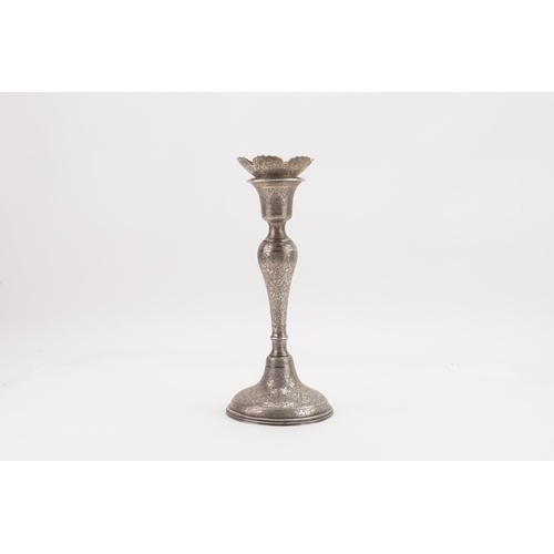 48 - A Iranian Silver Candlestick Holder decorated with various Scenes. Weighing: 302 grams.