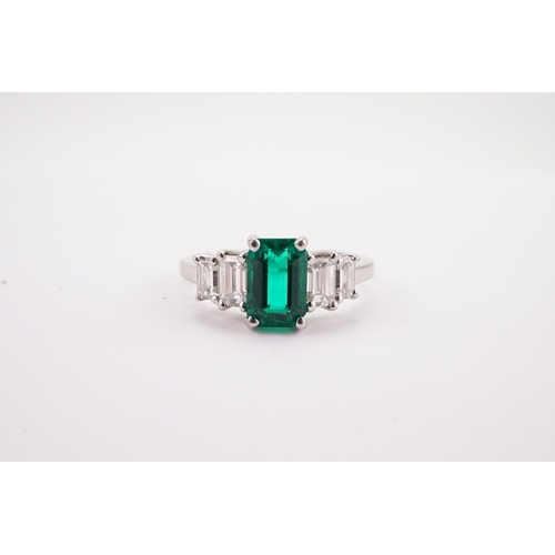 86 - A Columbium Natural Emerald and Diamond Set Ring, set with colourless rectangular diamond shoulders.... 