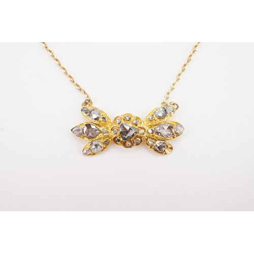 93 - A British colonial style high carat gold and rose cut diamond set necklace, designed as a bow format... 