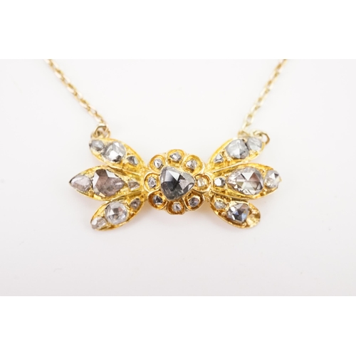 93 - A British colonial style high carat gold and rose cut diamond set necklace, designed as a bow format... 