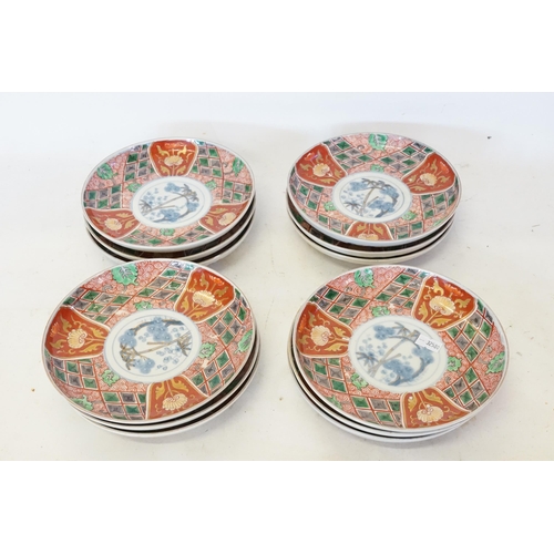 453 - A Set of 12 Imari Rust, Green & Gold Saucer Dishes.