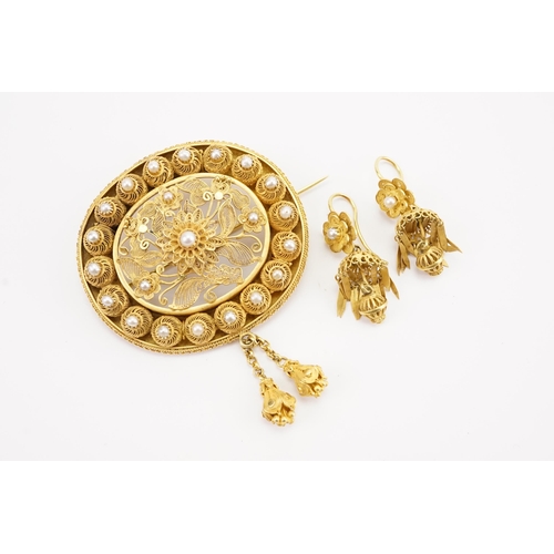 94 - A Iranian high carat gold and pearl set filigree brooch, along with the matching pearl set earrings.... 