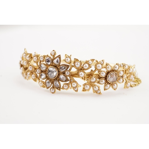 98 - A high carat gold rose cut diamond and seed pearl set bracelet, in a floral leaf design, safety chai... 