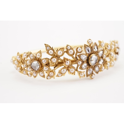 98 - A high carat gold rose cut diamond and seed pearl set bracelet, in a floral leaf design, safety chai... 