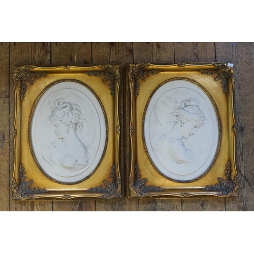 397 - A Pair of Marble Effect Oval Classical design & Gilt mounted Pictures. Measuring: 41cms x 53cms.