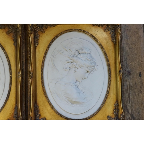 397 - A Pair of Marble Effect Oval Classical design & Gilt mounted Pictures. Measuring: 41cms x 53cms.