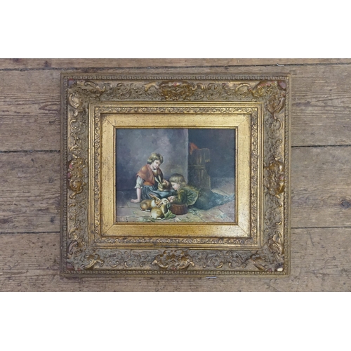 363 - A painting of Two Children playing with Rabbits in a Gilt Frame Signed LC. Measuring: 46cms x 40cms.