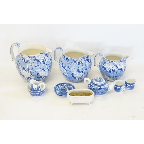 508 - A Graduated Set of Blue & White Chrysanthemum patterned Jugs, Blue etc.