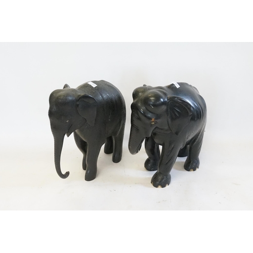 545 - Two Carved Hardwood Studies of Elephants. Measuring: 25cms High.